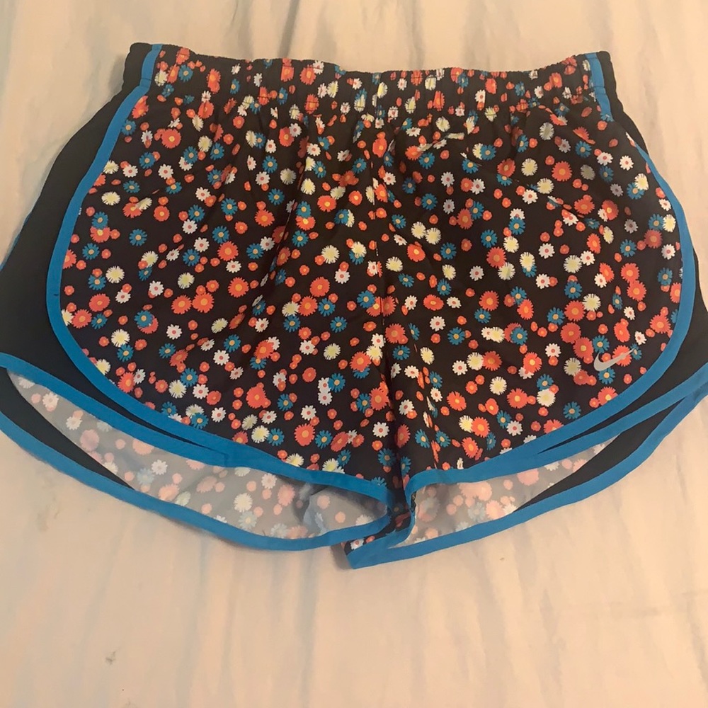 Multi colored Shorts w/brief inside.